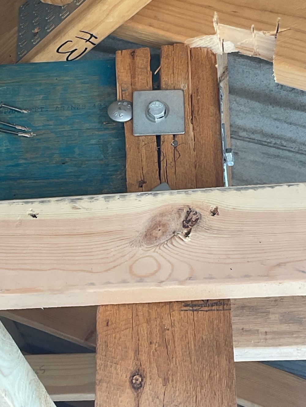 Porch post split at the bolts, with the post to beam connection not secure, found during a fixing inspection in Aintree