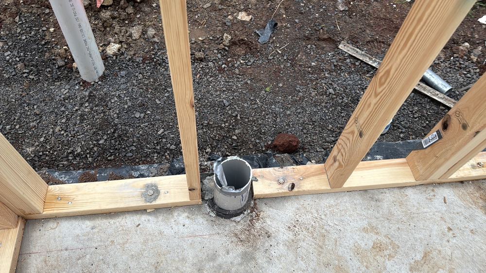 Bottom plate cut through in a load-bearing wall without an approved fix, found during a frame inspection in Aintree