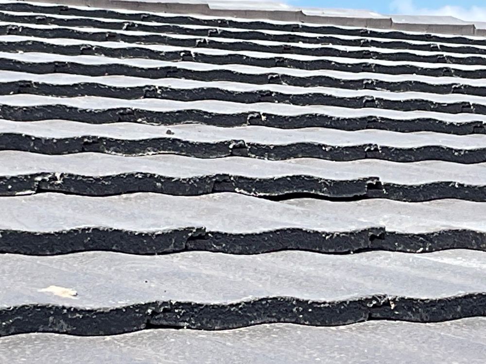 Tiles needing to be reset so the roof sheds water as designed, Aintree, Deanside