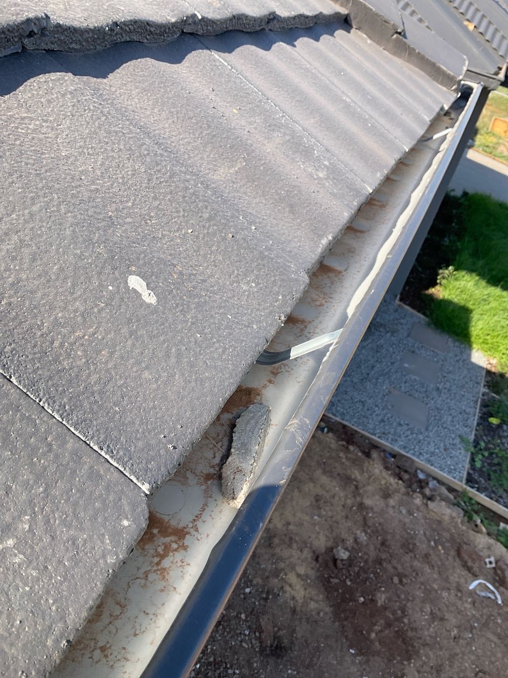 Debris still sitting in the gutters at handover, Aintree, Deanside