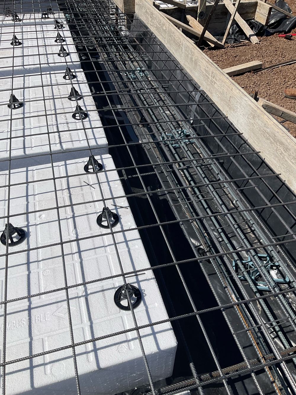 Garage threshold mesh not bent down 50mm into the rebate as the engineering shows, found during a slab pre-pour inspection in Hoppers Crossing